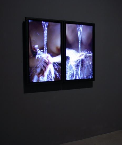 installation view of two videos next to eachother