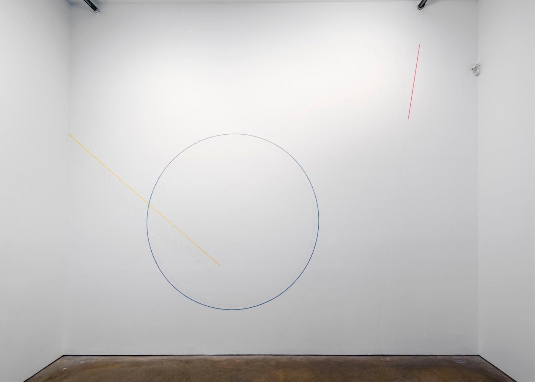 wall art of a circle, a yellow line, and a red line