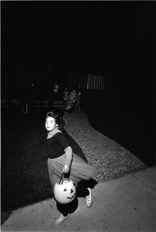 grayscale image of a trick-or-treater