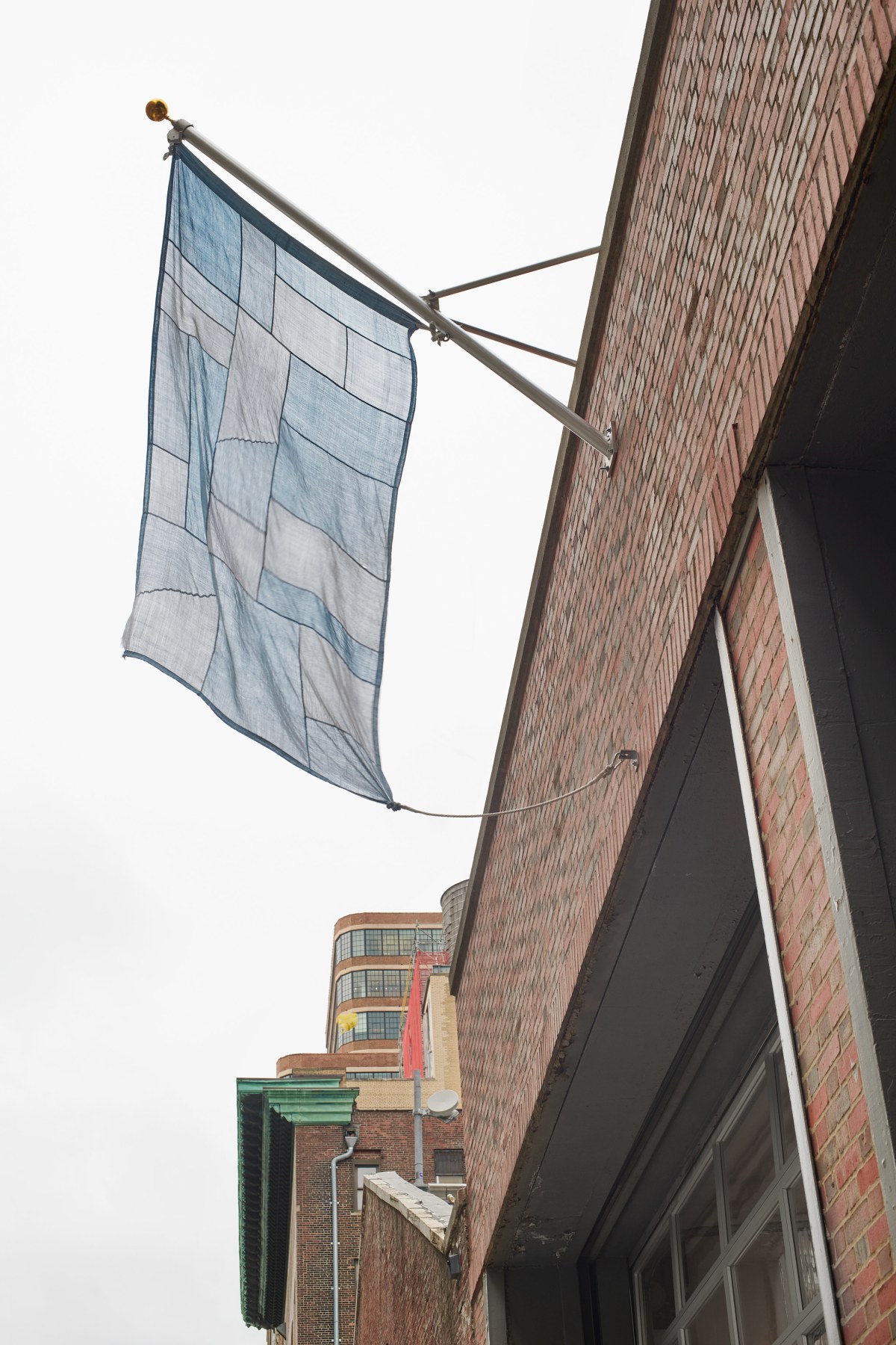 blue flag hanging from the gallery's entrance