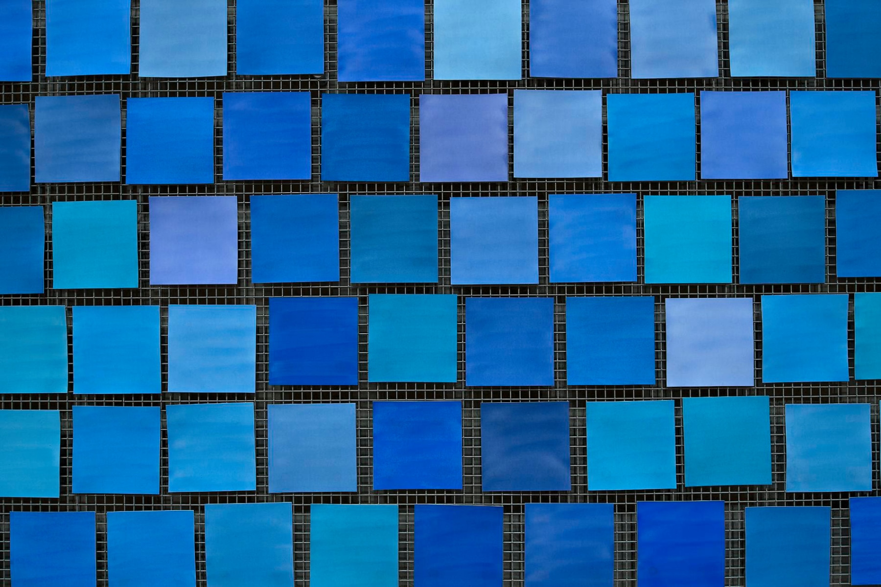 Detailed Installation View, Spencer Finch, Trying to Remember the Color of the Sky on That September Morning (squares of different hued blues)