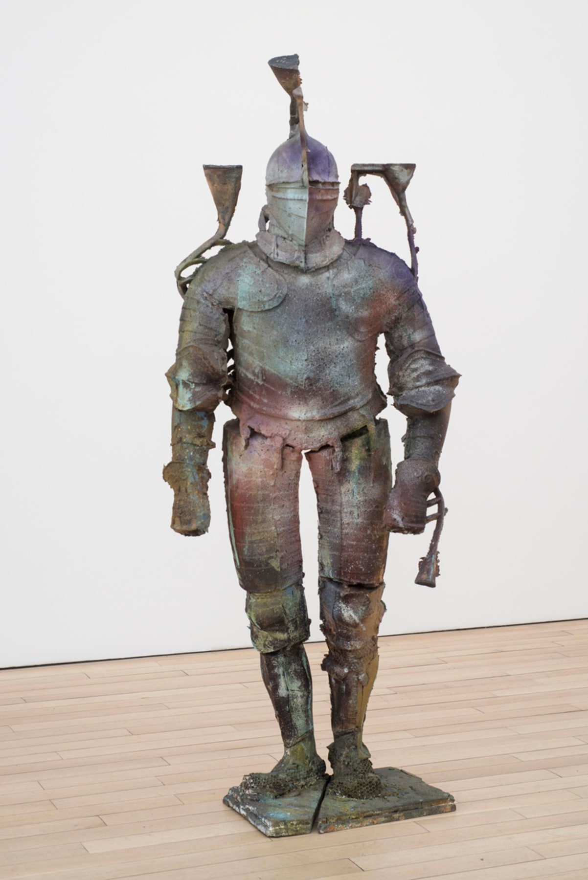 statue of a medieval knight of varying dark hues