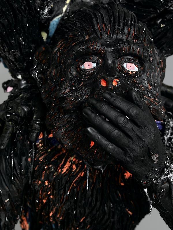 ape covered in black paint