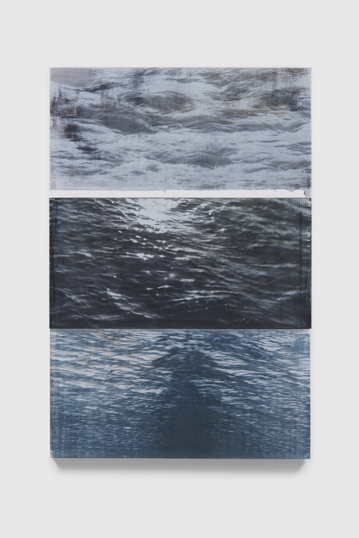 Three different depictions of ocean in black and blue colors