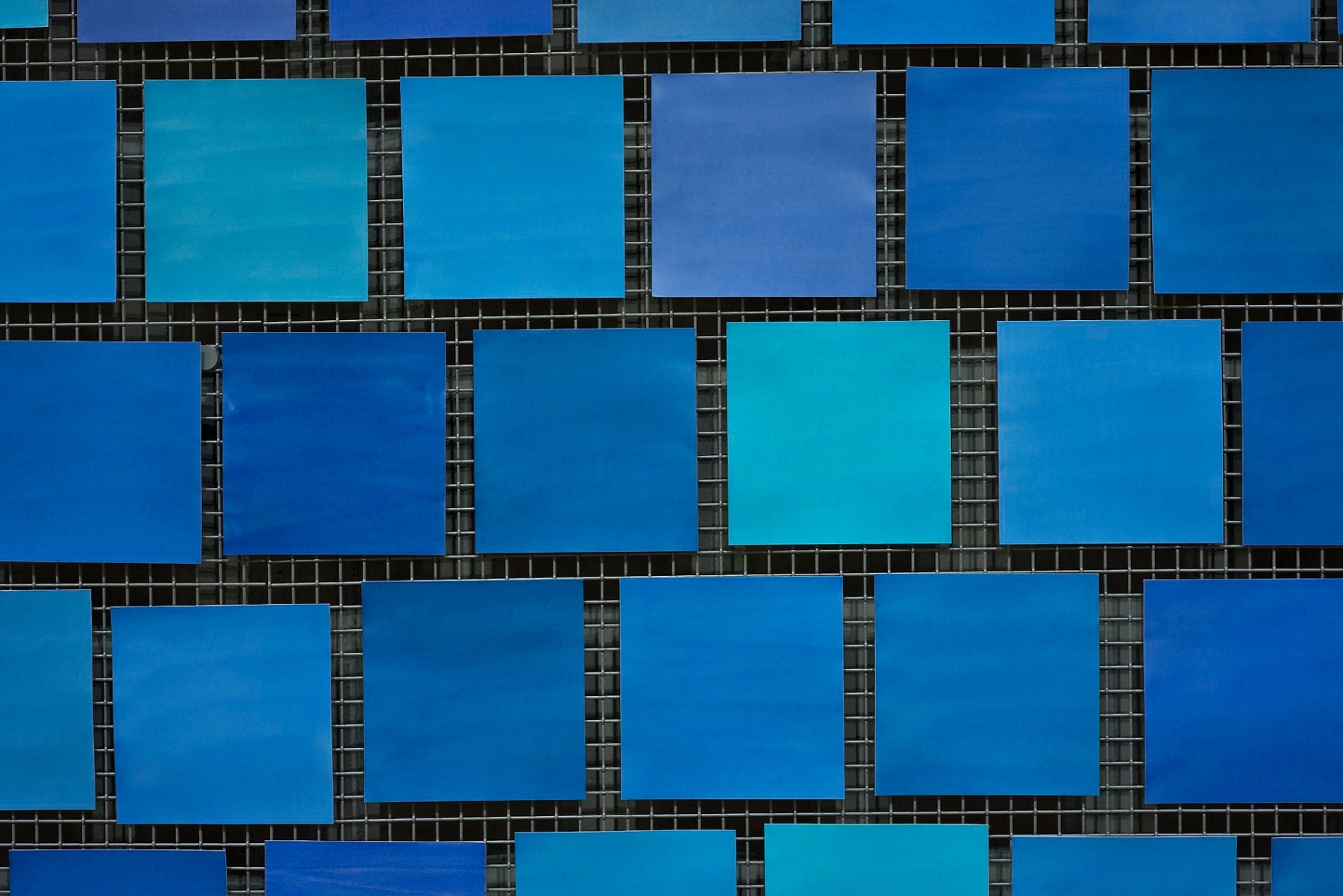 Detailed Installation View, Spencer Finch, Trying to Remember the Color of the Sky on That September Morning (squares of different blue hues)