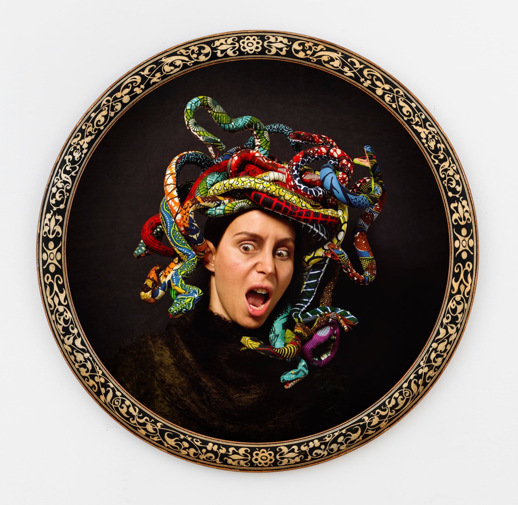 head of Medusa with many colorful snakes