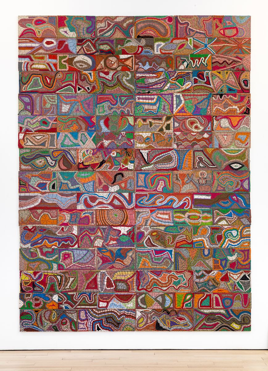 reclaimed electrical wires and components creating a variety of colorful shapes on a panel