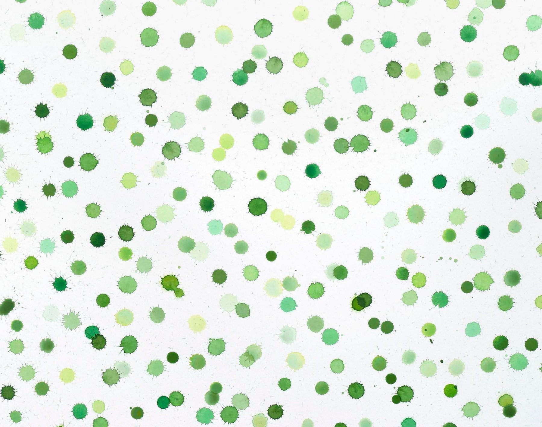 green paint dots on canvas