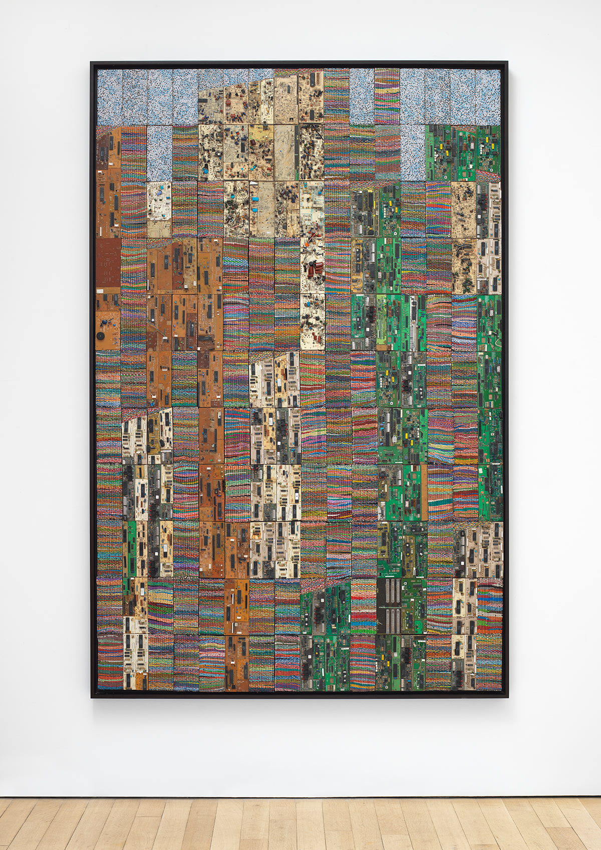 reclaimed electrical wires and components creating a multicolored pattern of rectangles