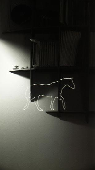 outline of a horse superimposed over a darkened image of shelves