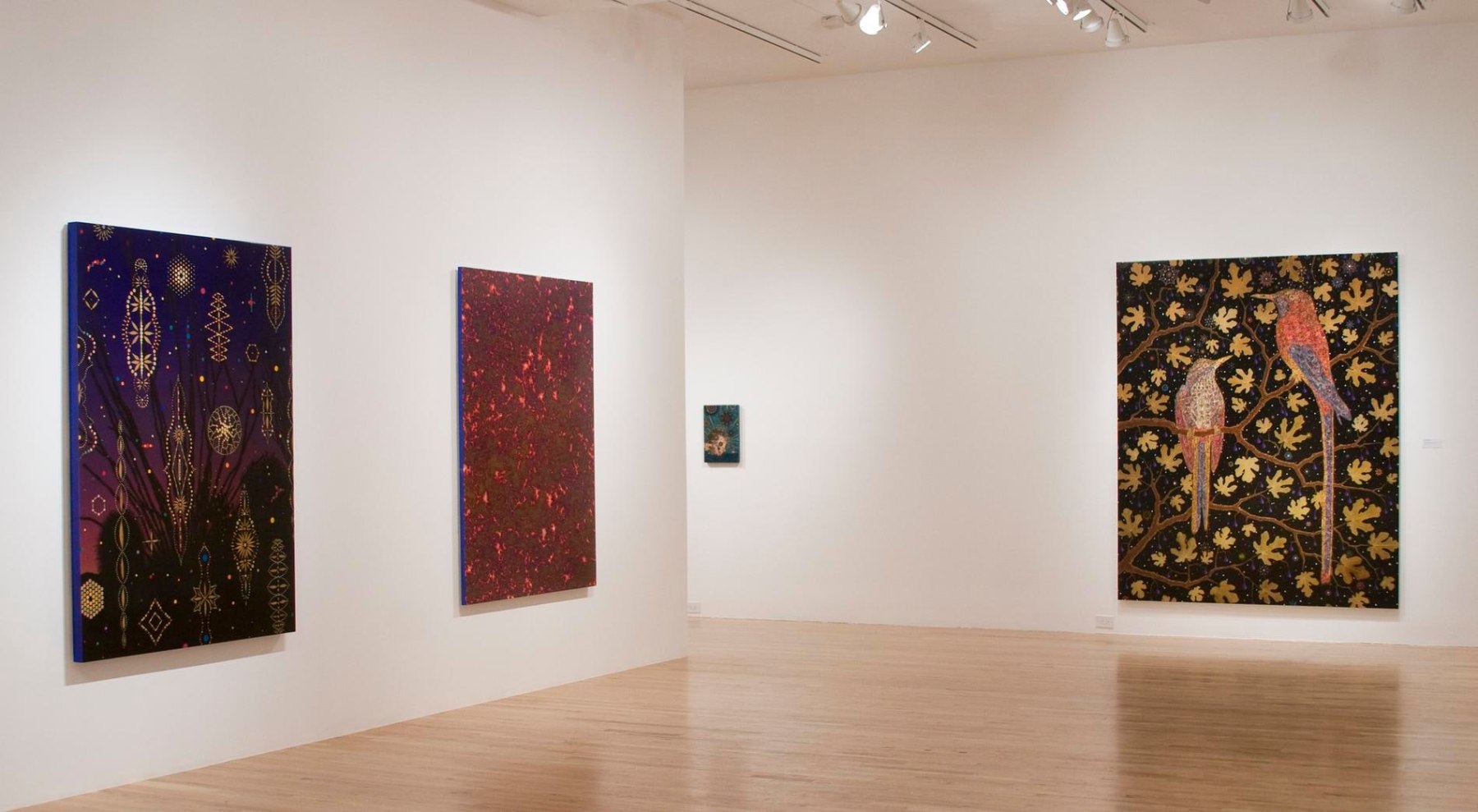 Exhibition view of three of Fred Tomaselli's artworks