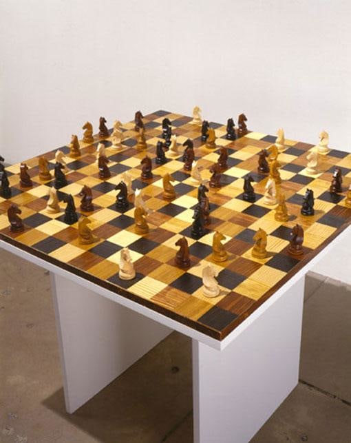 knight chess pieces on a board that resembles a chess board