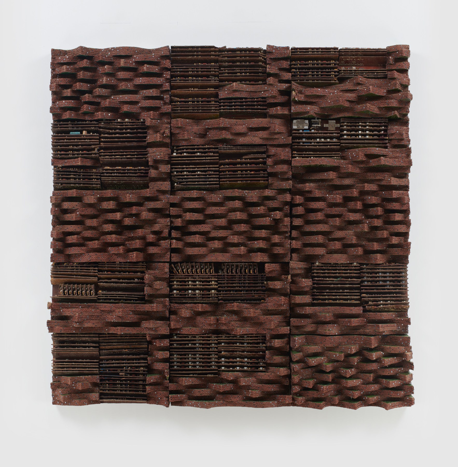 woven electrical wires and components on panel creating a brown surface