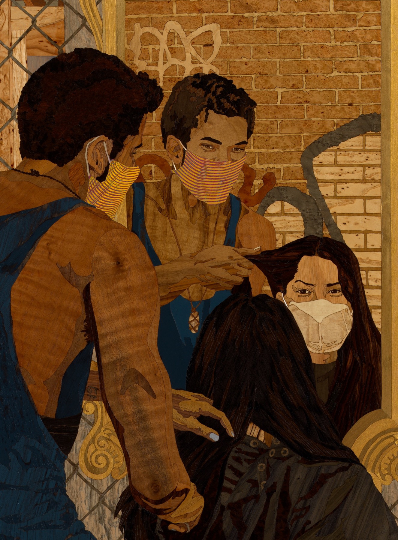 A wooden artwork depicting a man giving a woman a haircut out on the streets; both are wearing face masks