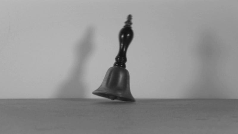 still of a tilted bell