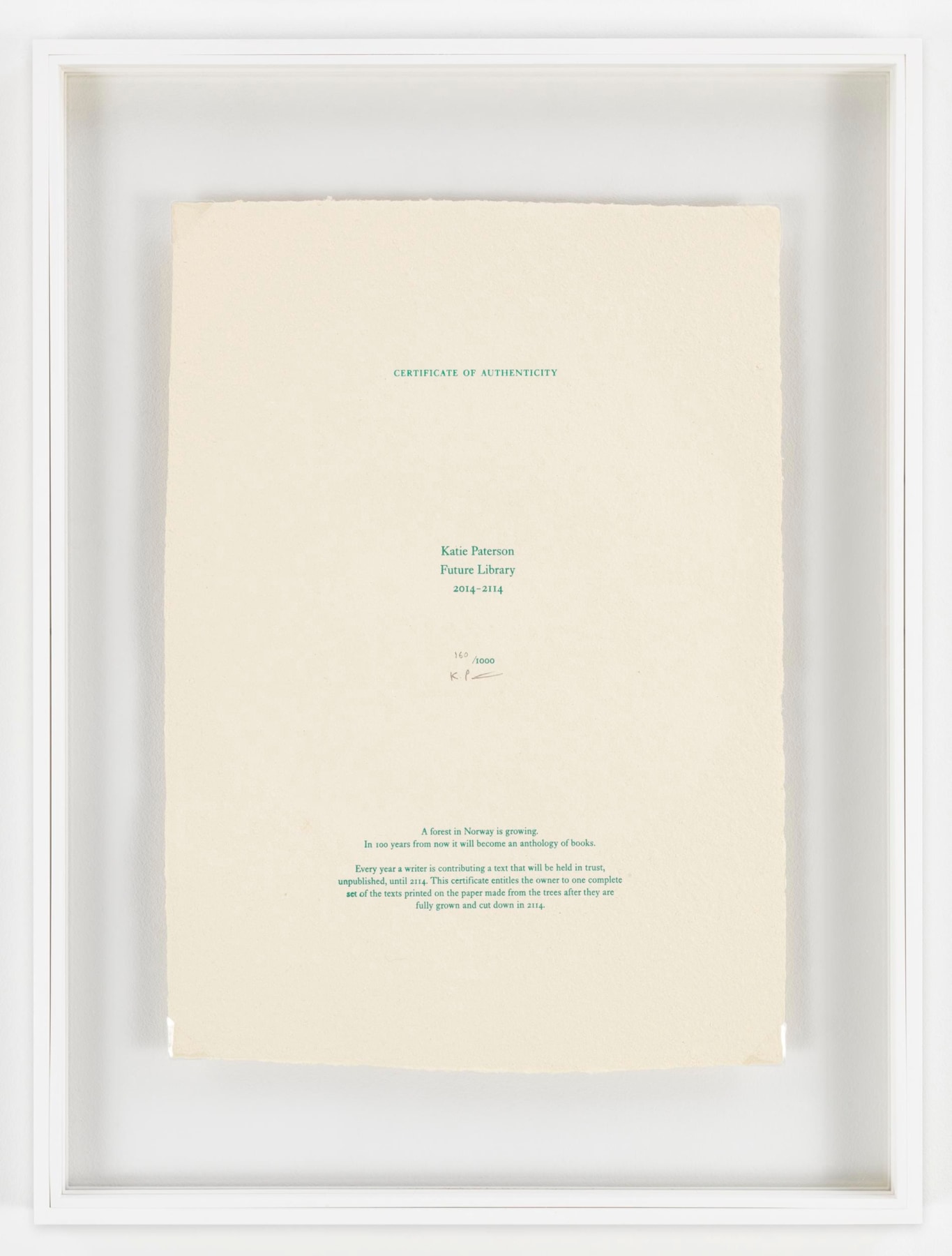 framed book page with green lettering