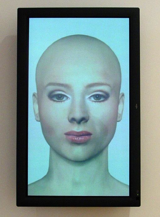 bald, white woman with heavy make-up