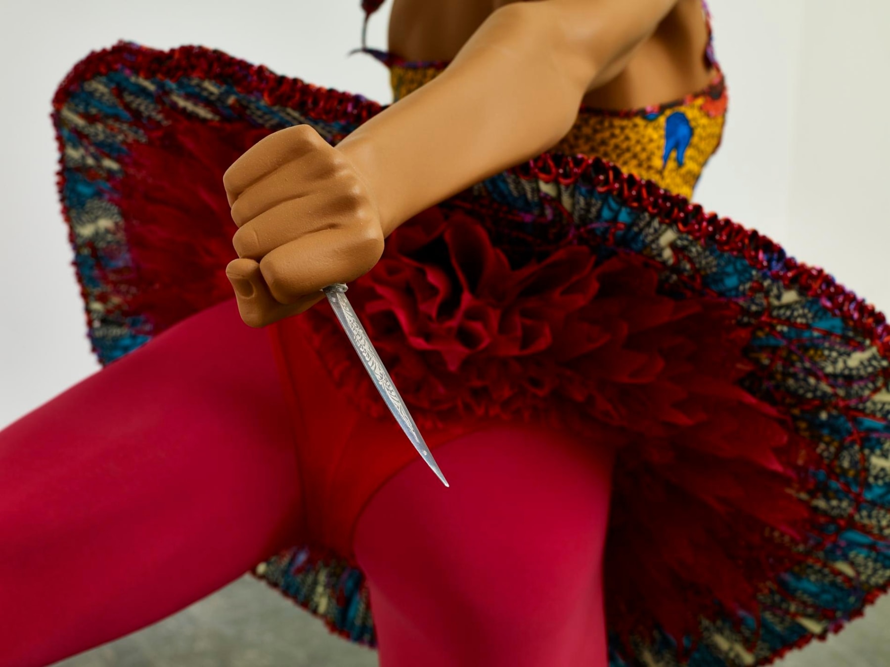 close up of the pocket knife held by the dancing mannequin