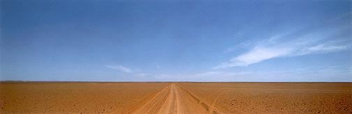 desert landscape juxtaposed with bright blue sky