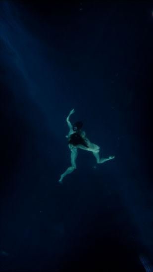 two people under water