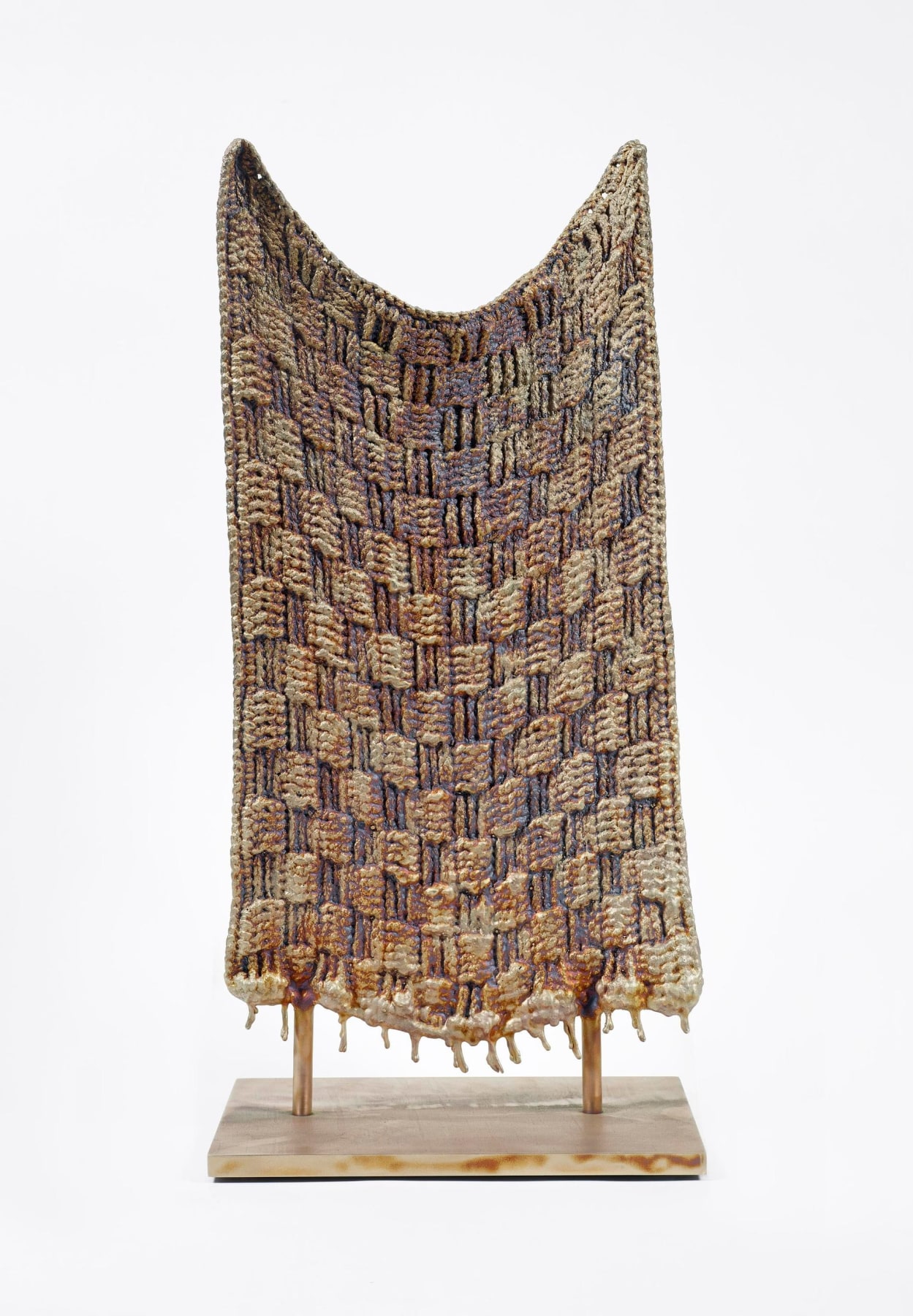 bronze sculpture shaped like a knitted quilt
