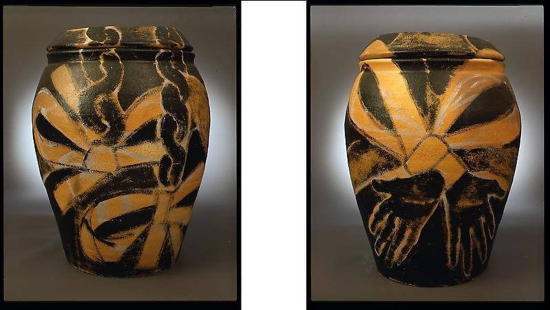 front and back of a vase featuring yellow ribbons painted on each side