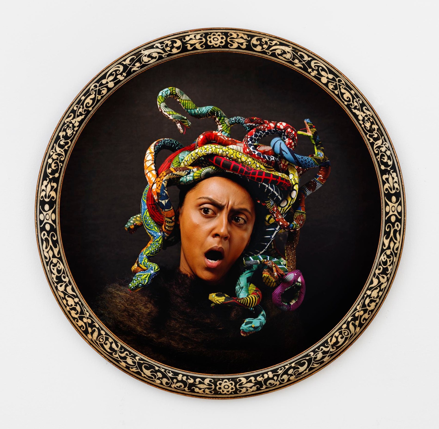 head of Medusa with many colorful snakes