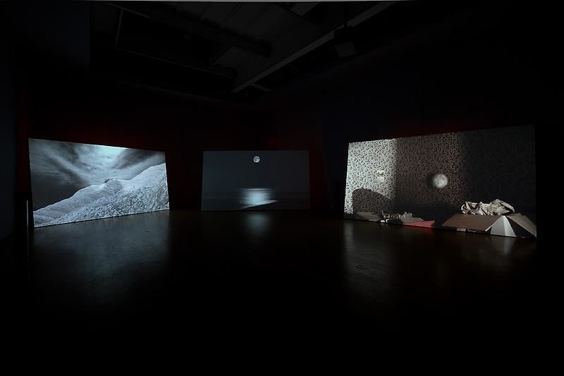 installation view of three video projections