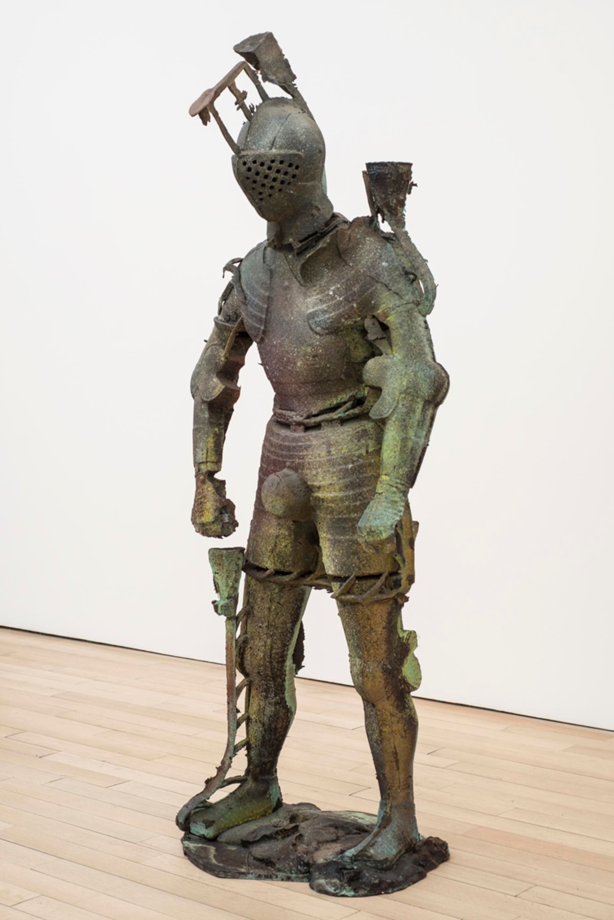 statue of a medieval knight with green and dark colored hues