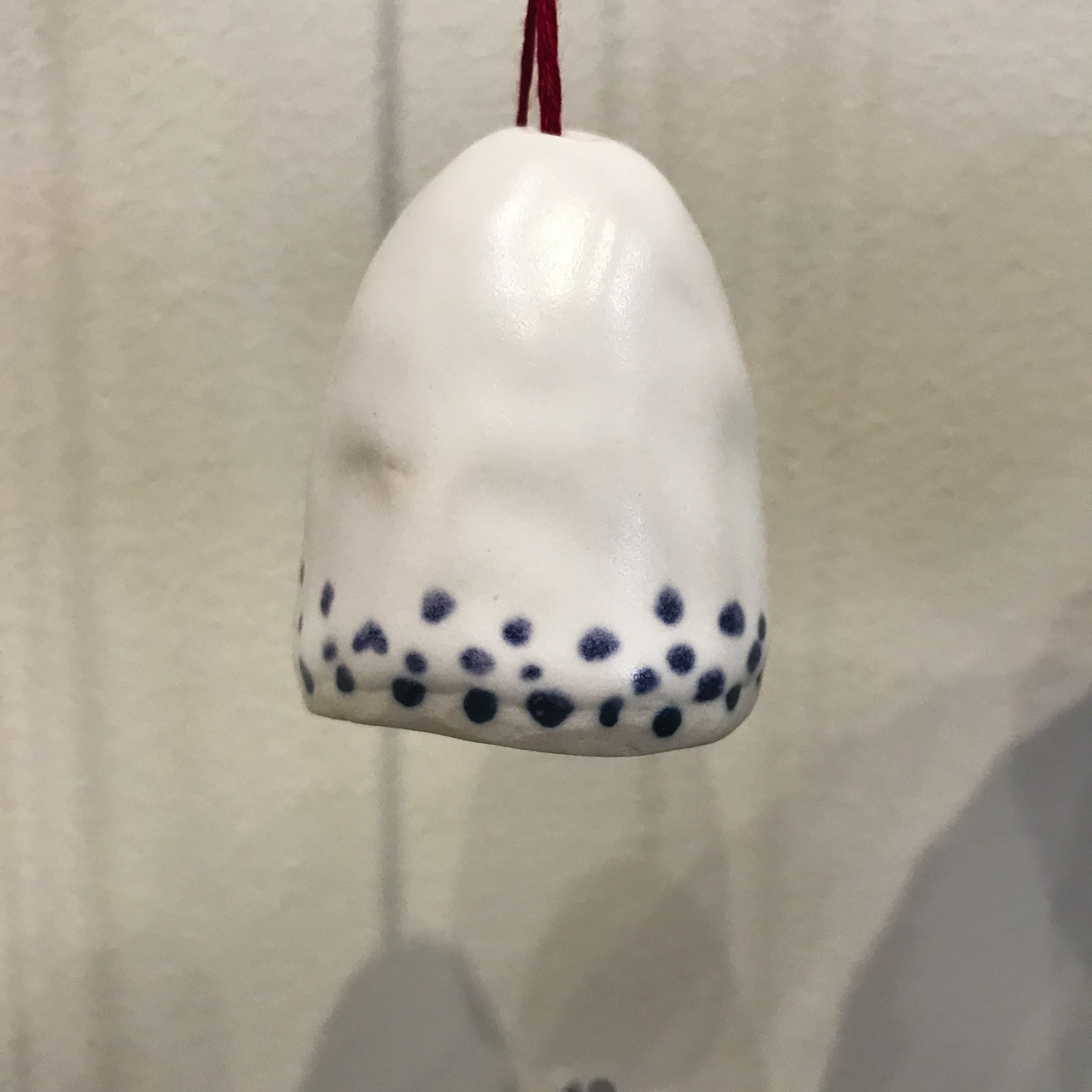 Amanda Humphries, Bell stoneware with thread and bead ​2018