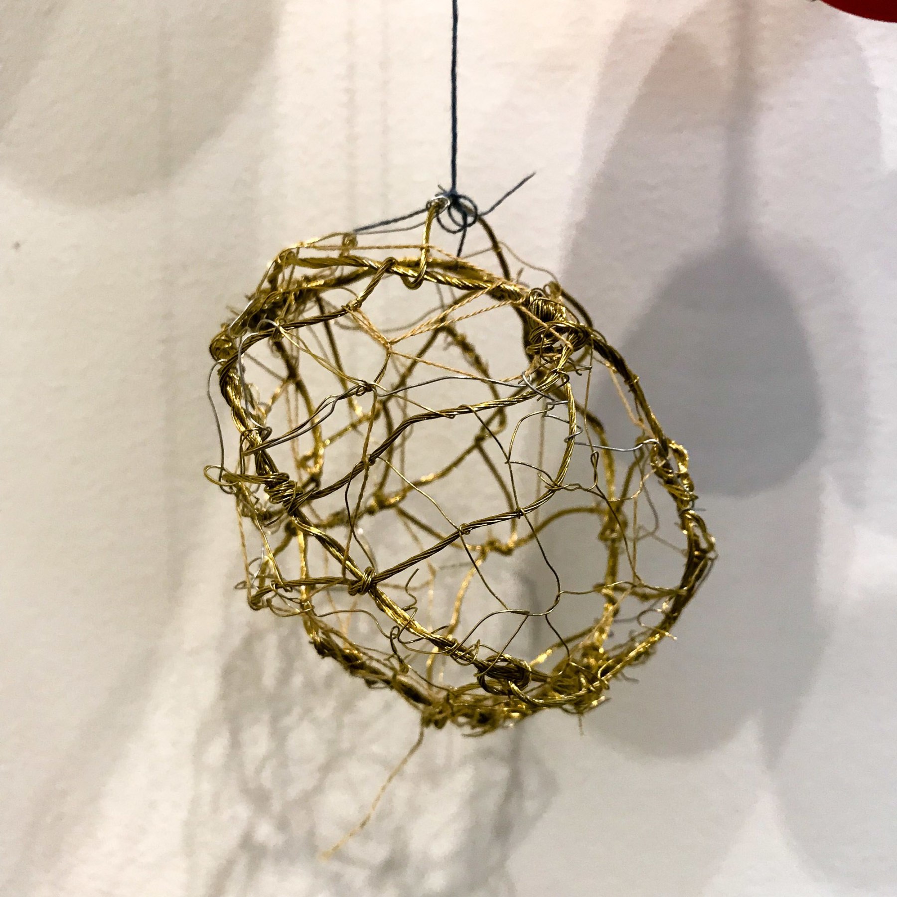 Amanda Humphries, Beloved Poet, porcelain with thread and wire, (Poem inside by poet Andrea Sheldon instagram @andreasheldon_) ​2018