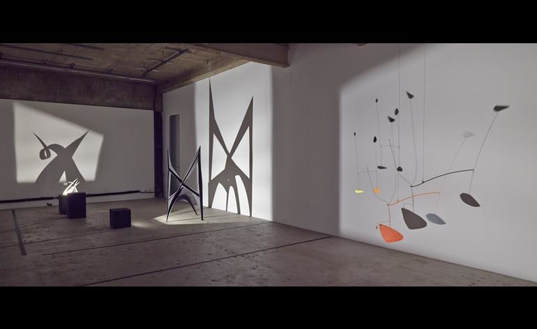 The novel display was inspired by archival images of Calder installing his sculptures in darkness and photographing them using directed light. The images caught the eye of the gallery&#039;s founder, Adam Lindemann, who decided to reorientate Calder&#039;s familiar aesthetic
