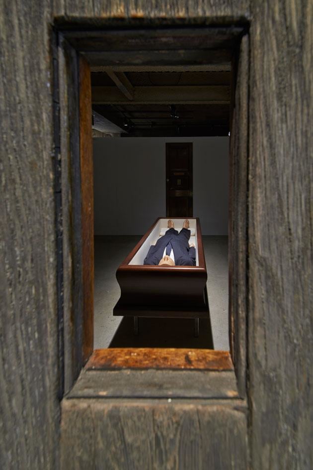 The space is split into seven rooms, with dark-painted walls creating mysterious chambers, each containing a single piece. Pictured is &#039;Now&#039;, 2004