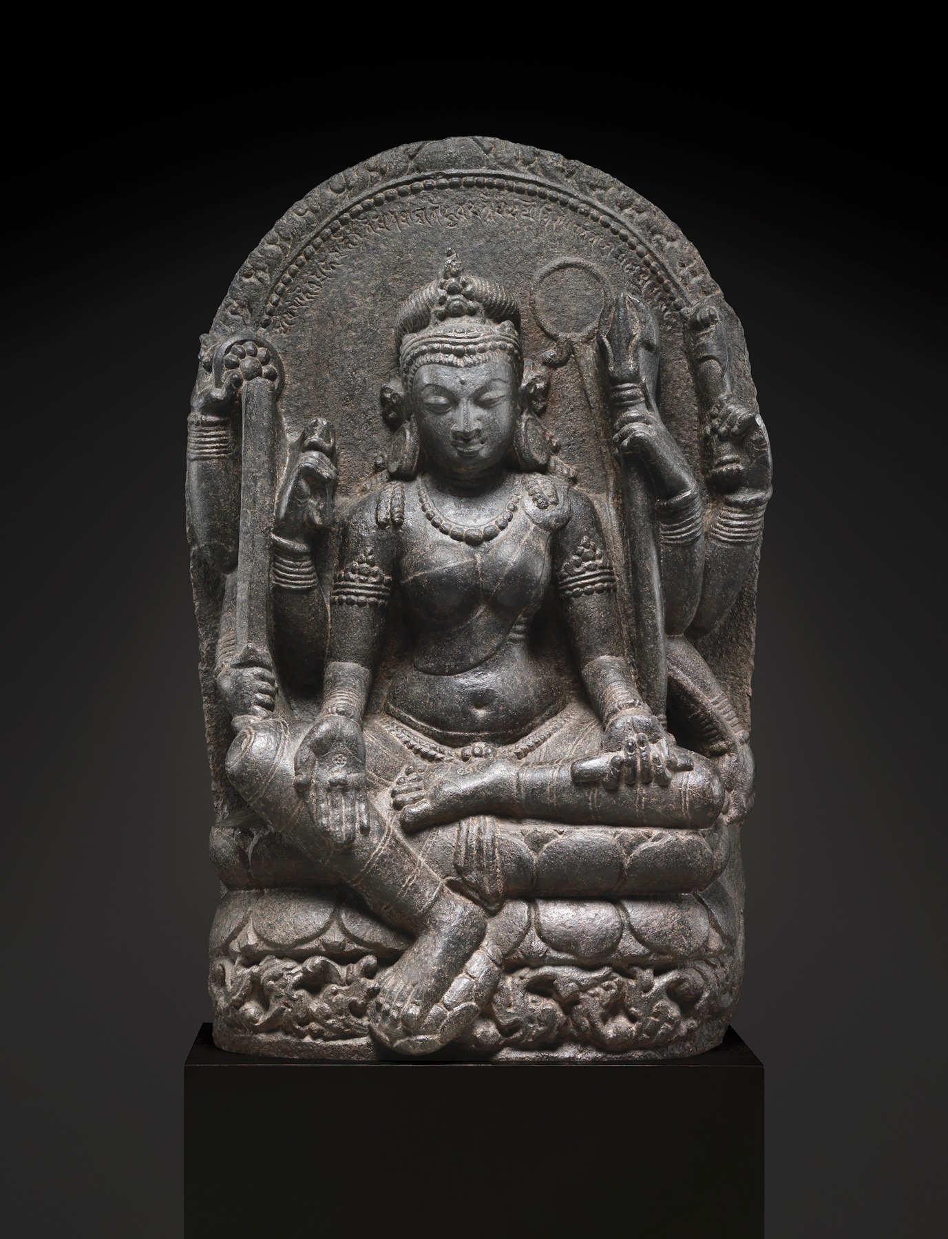 Larger photo of This remarkable sculpture portrays Mahapratisara, the principal Raksha goddess, with her distinctive eight arms adorned with various symbolic attributes.