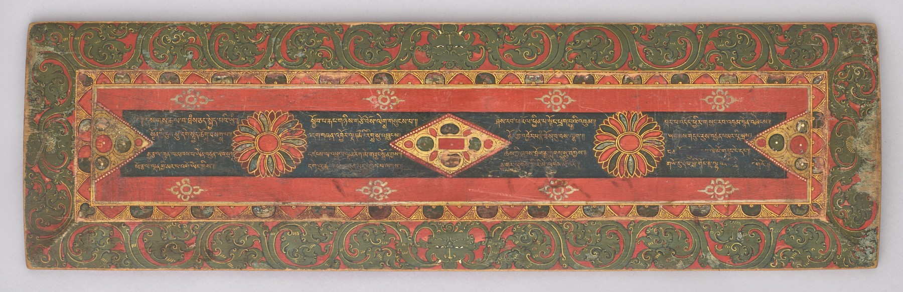 this remarkable cover is an aesthetically elegant and rare object and contains a sixteen-lined poem, beautifully executed in calligraphy by Marpa Gyor