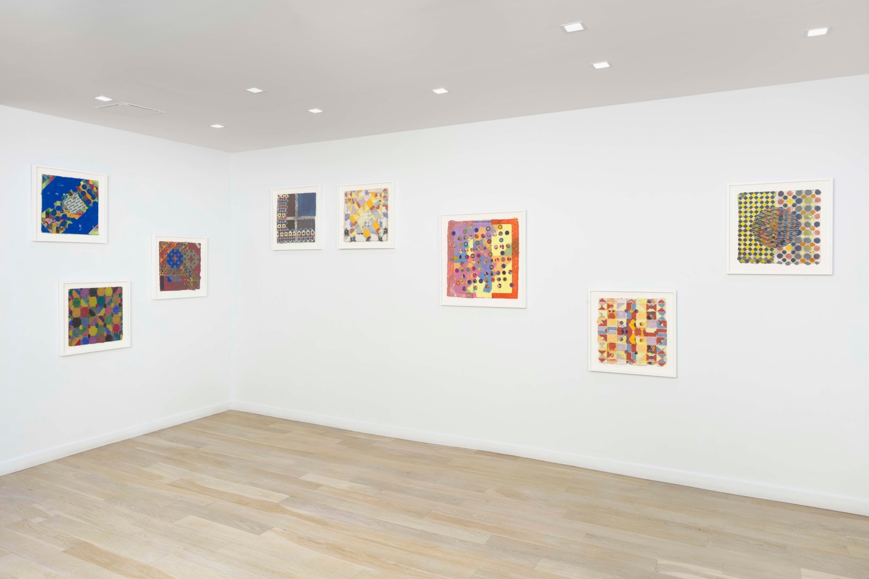 installation view of framed works on paper