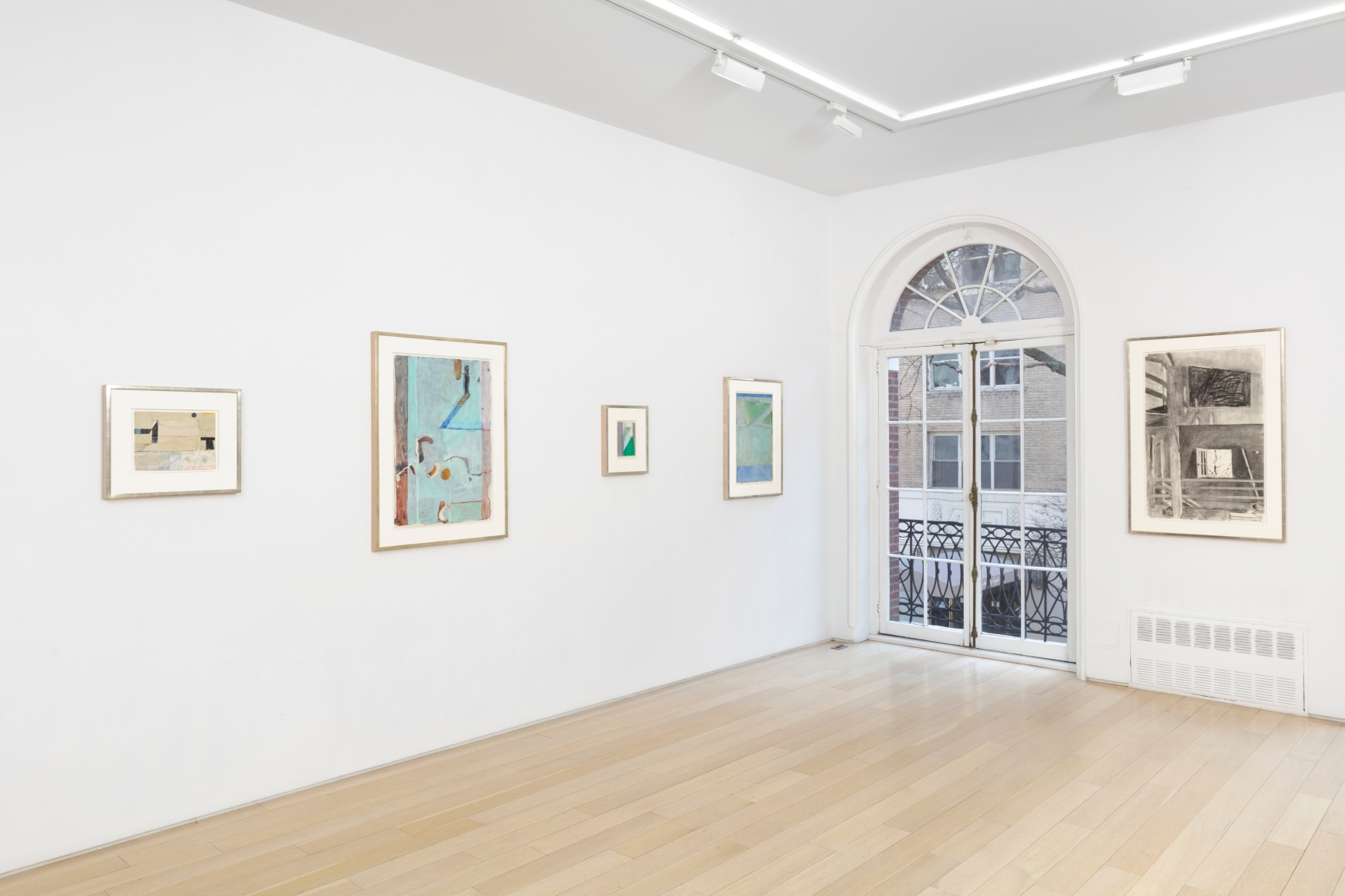 installation view with multiple framed works