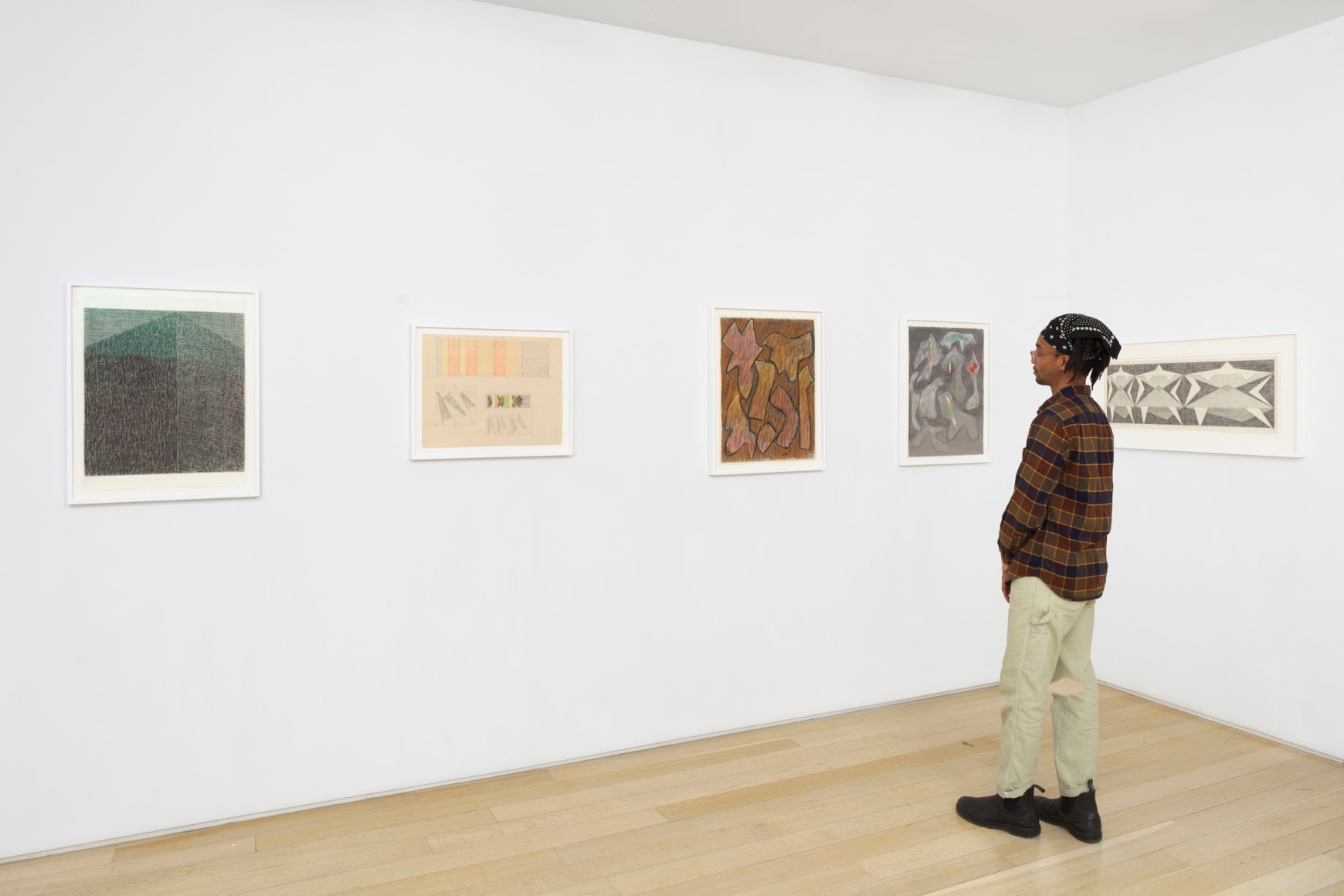 installation view with framed drawings
