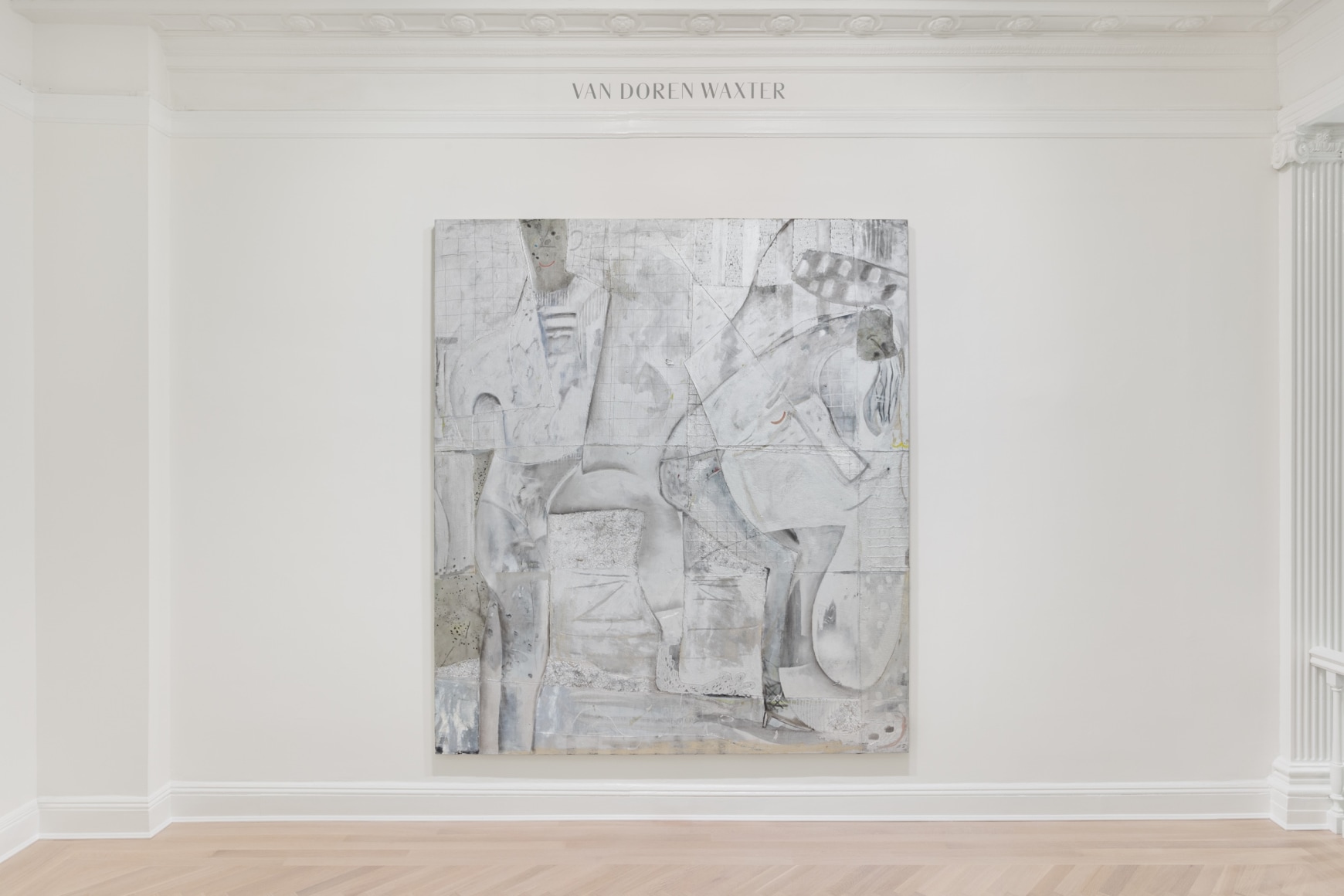 Installation view of a silver painting of two figures in the lobby of our building