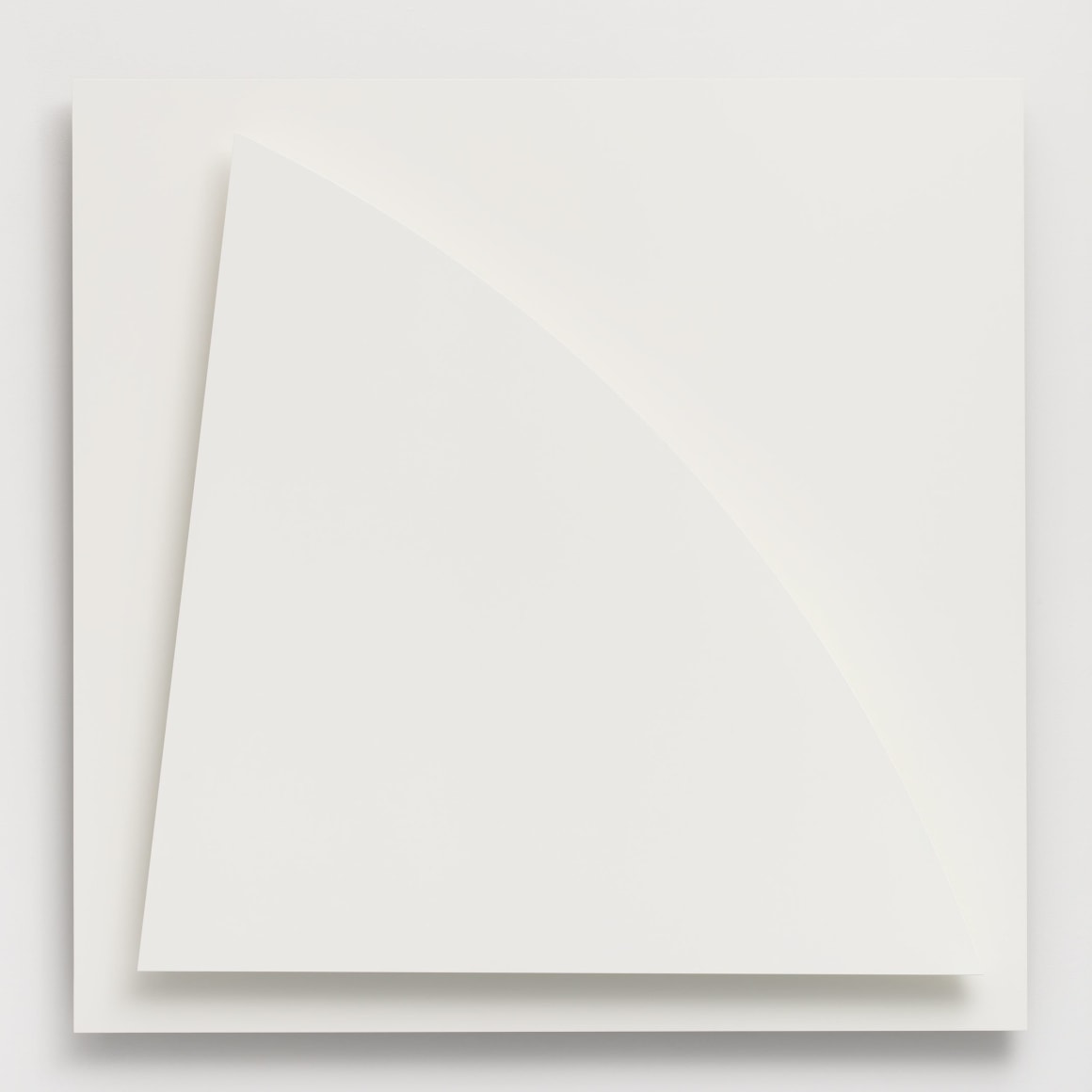 two large sheets of while metal laid over one another with a slight curved shadow