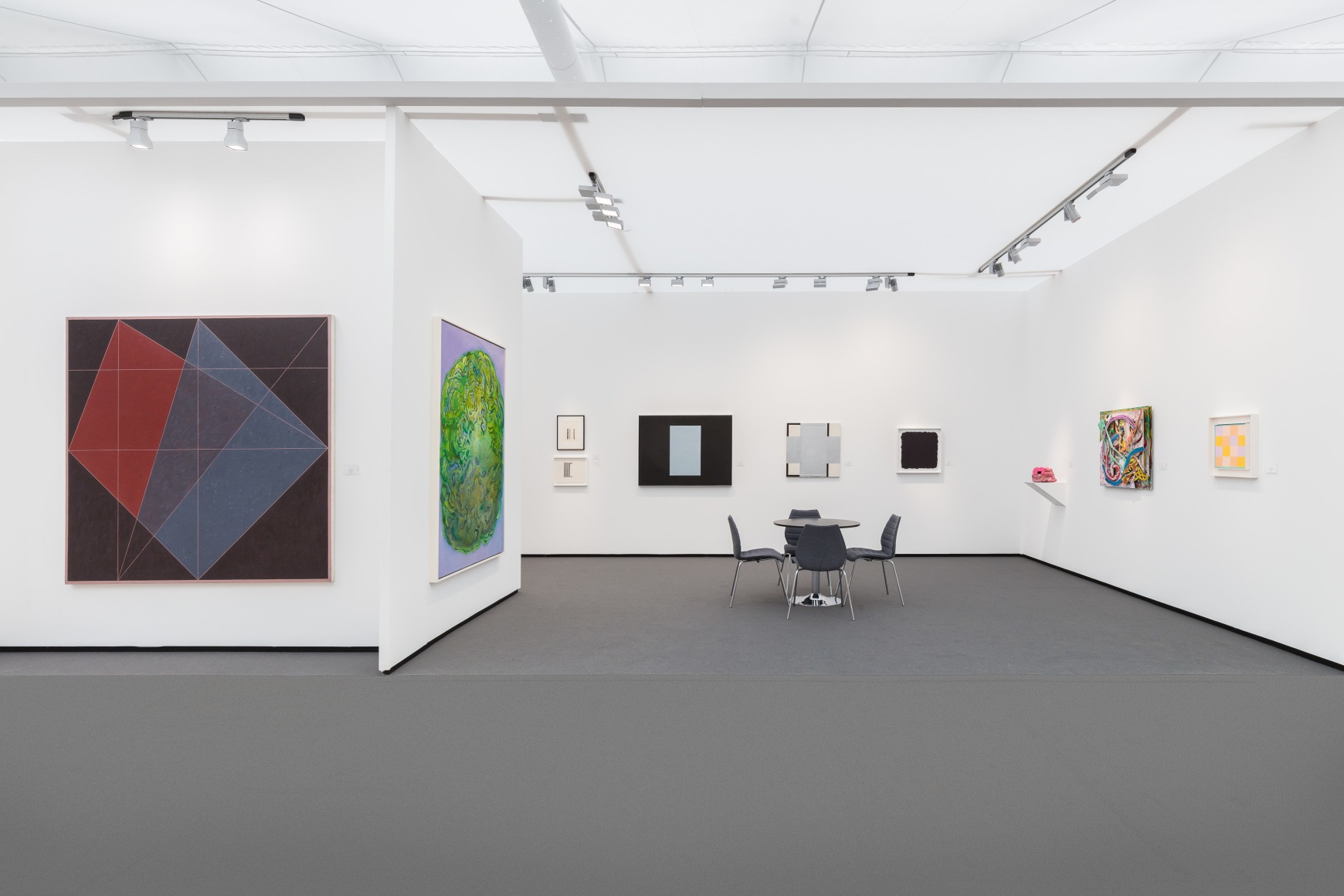 art fair booth with various items hung on the walls