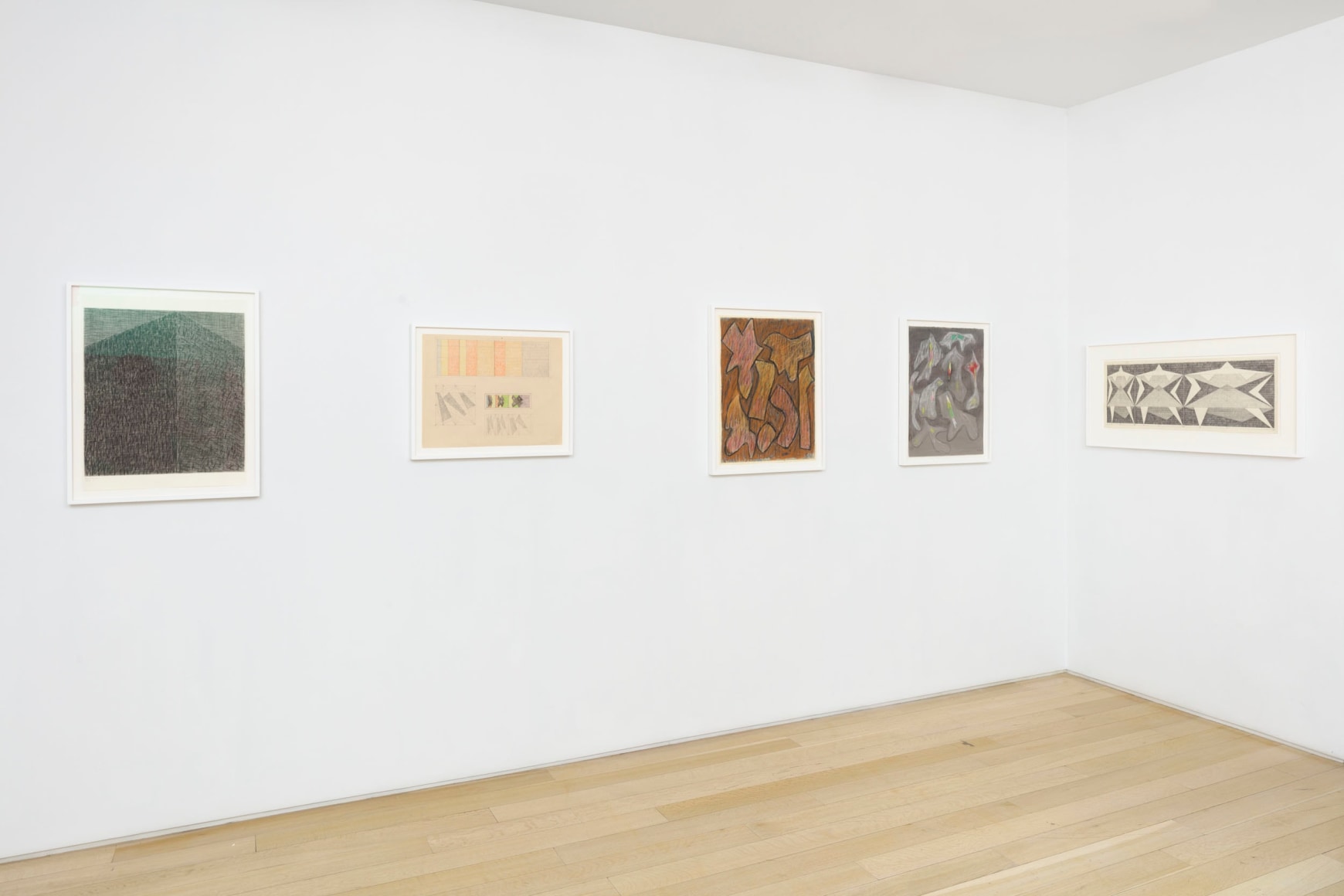 installation view with framed drawings