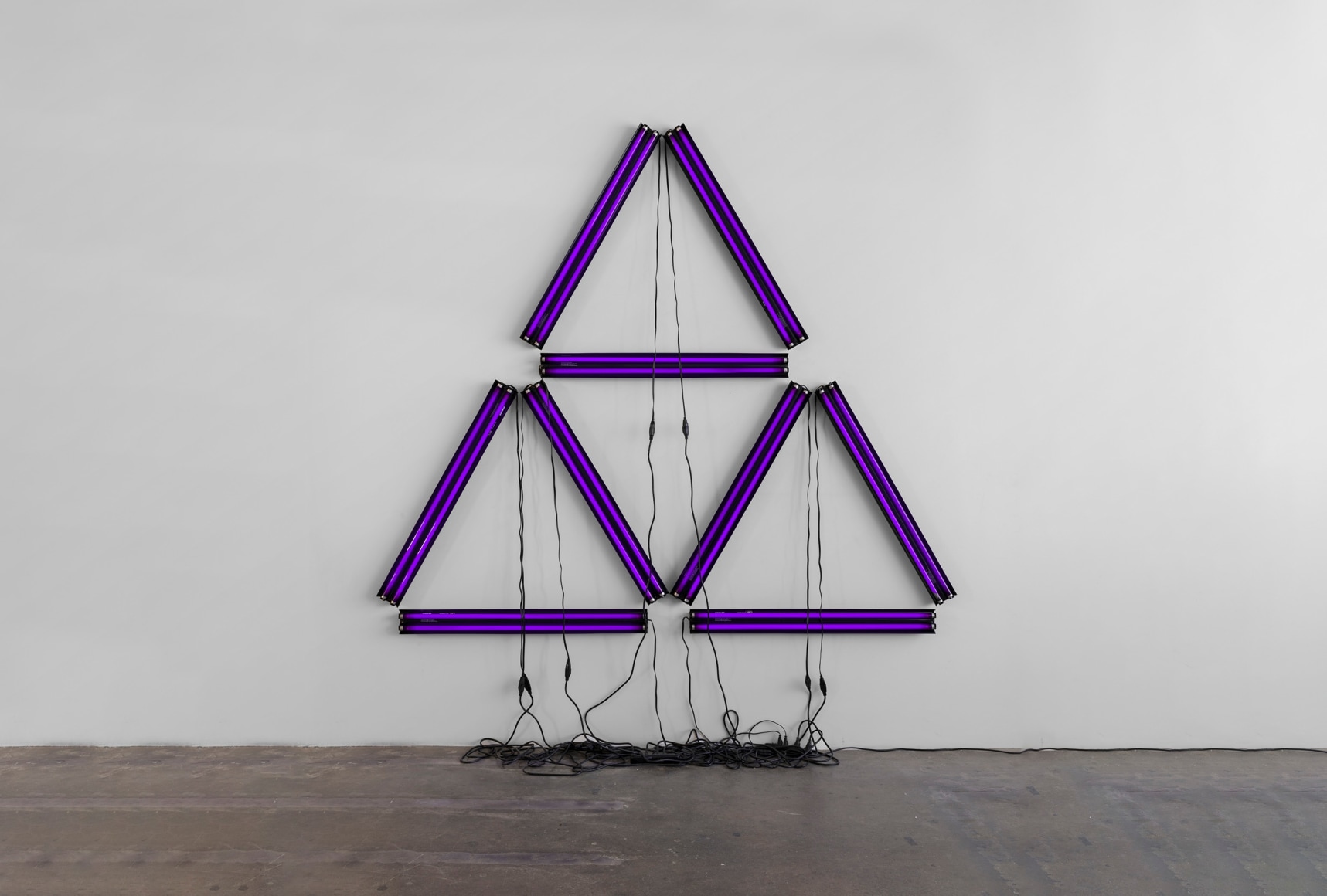 Paul Stephen Benjamin,&nbsp;Black Illuminati,&nbsp;2021, blacklight, black power strip, black extension cord, 120 x 113 in &nbsp;(304.8 x 287 cm)