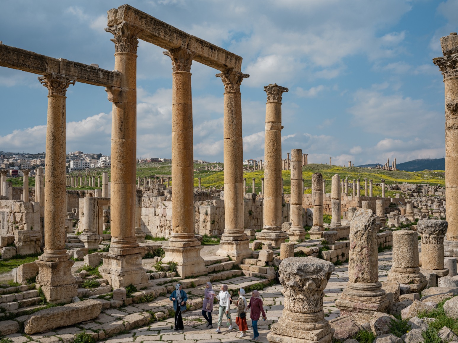 Lucas Foglia, Ghina, Raghad, Yusra, Nahla, and Rahaf Walking through Roman Ruins after Leaving Palestine, Jordan, 2022