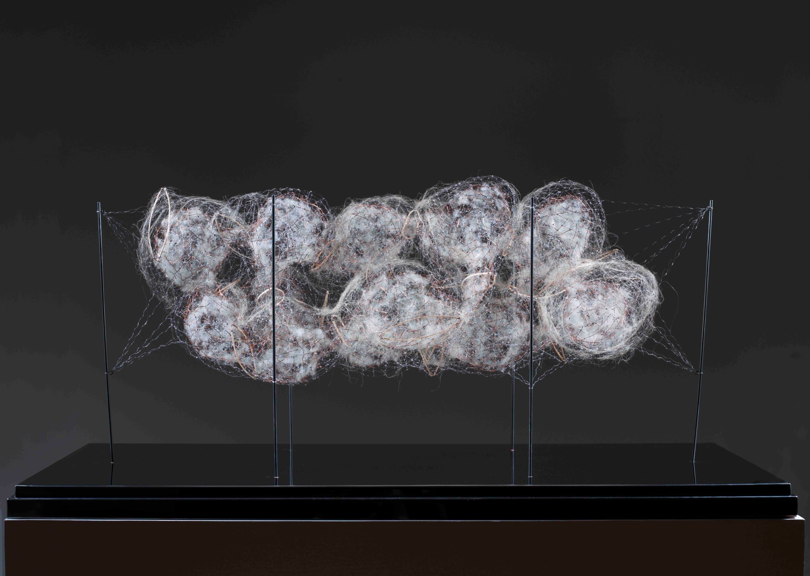 Interior fluid, painted wire, copper, steel, wool and esparto grass on stainless steel base, 72h x 124 x 58 cm