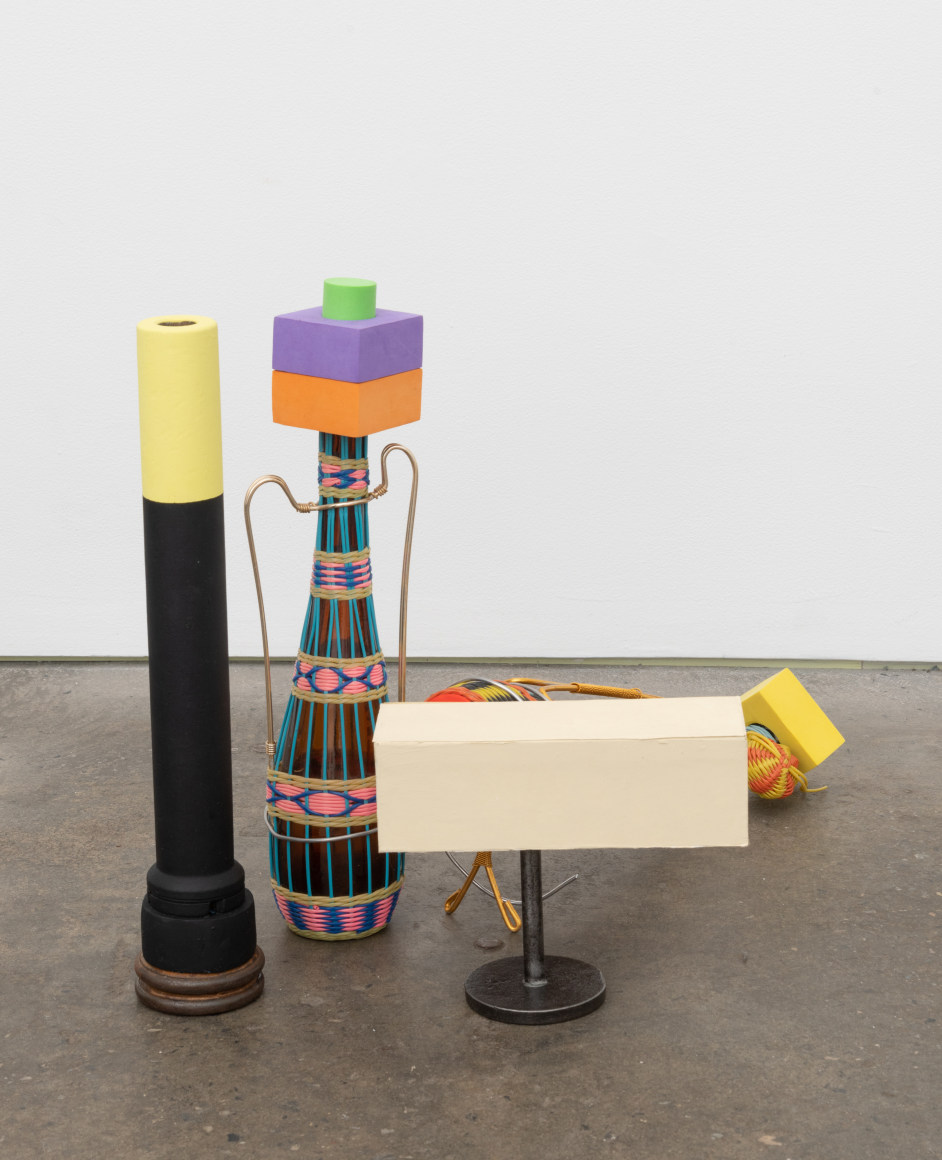 Shapes and things, 2022, two Spanish wine bottles, metal post, wooden post, child's toy shapes