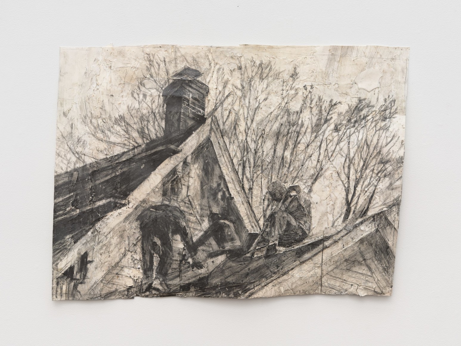 Men working on the roof of a house with two steeples.