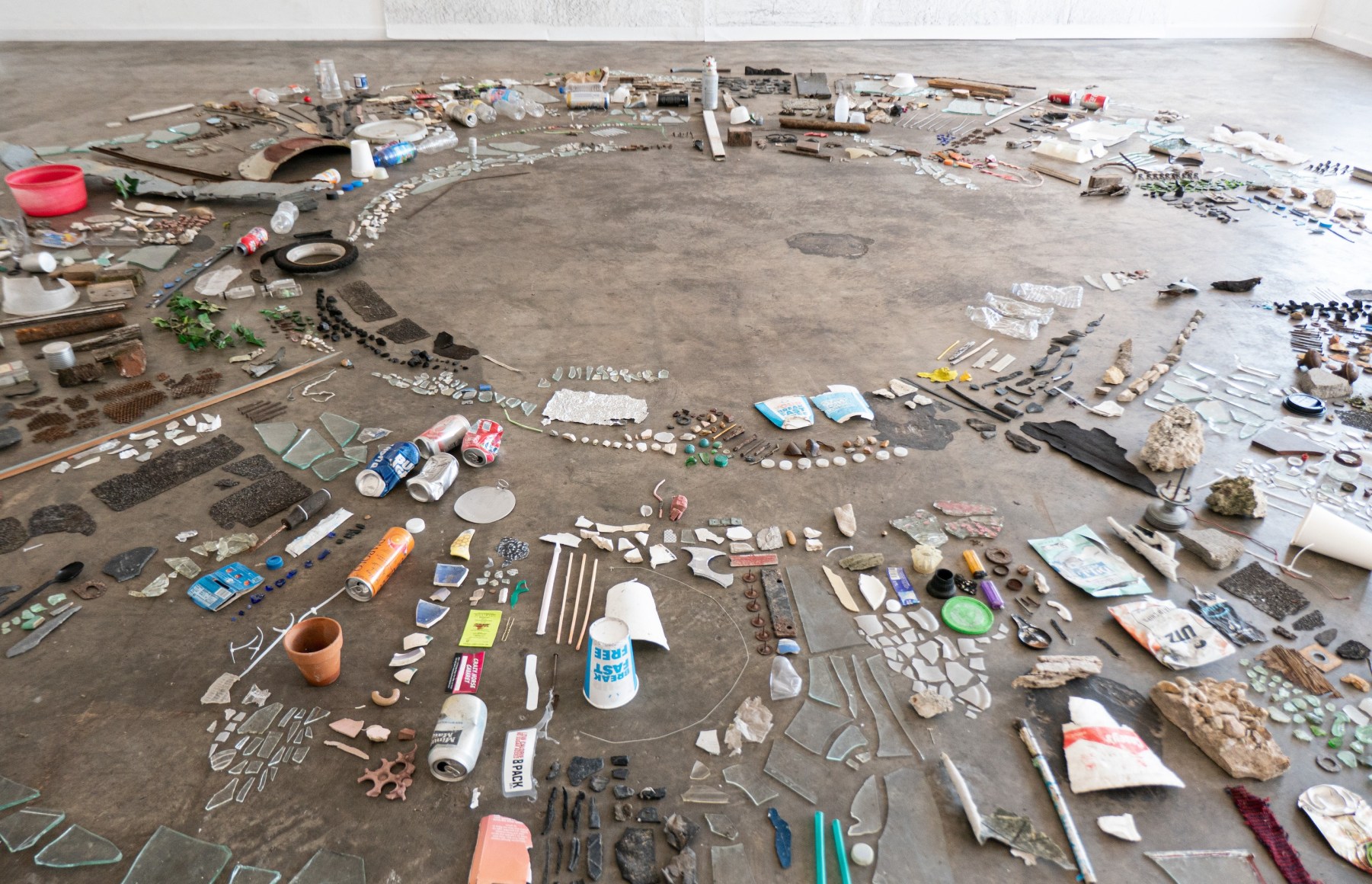 Erin Woodbrey  of the Sun&nbsp;(Baton Rouge, LA), 2022  Found objects, and fragments of plastic, paper, glass, foam, aluminum, tin, and organic matter  Variable dimensions  Detail View