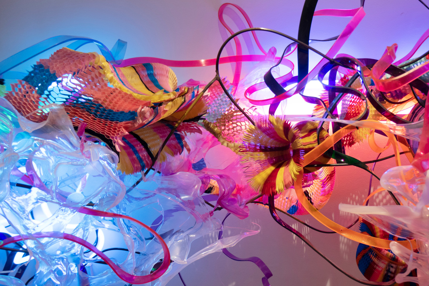 Artist Judy Pfaff's installation view of opsins, a solo exhibition at Gaa Gallery Provincetown - Detail view of wall sculpture comprised of plastic, acrylic and found objects