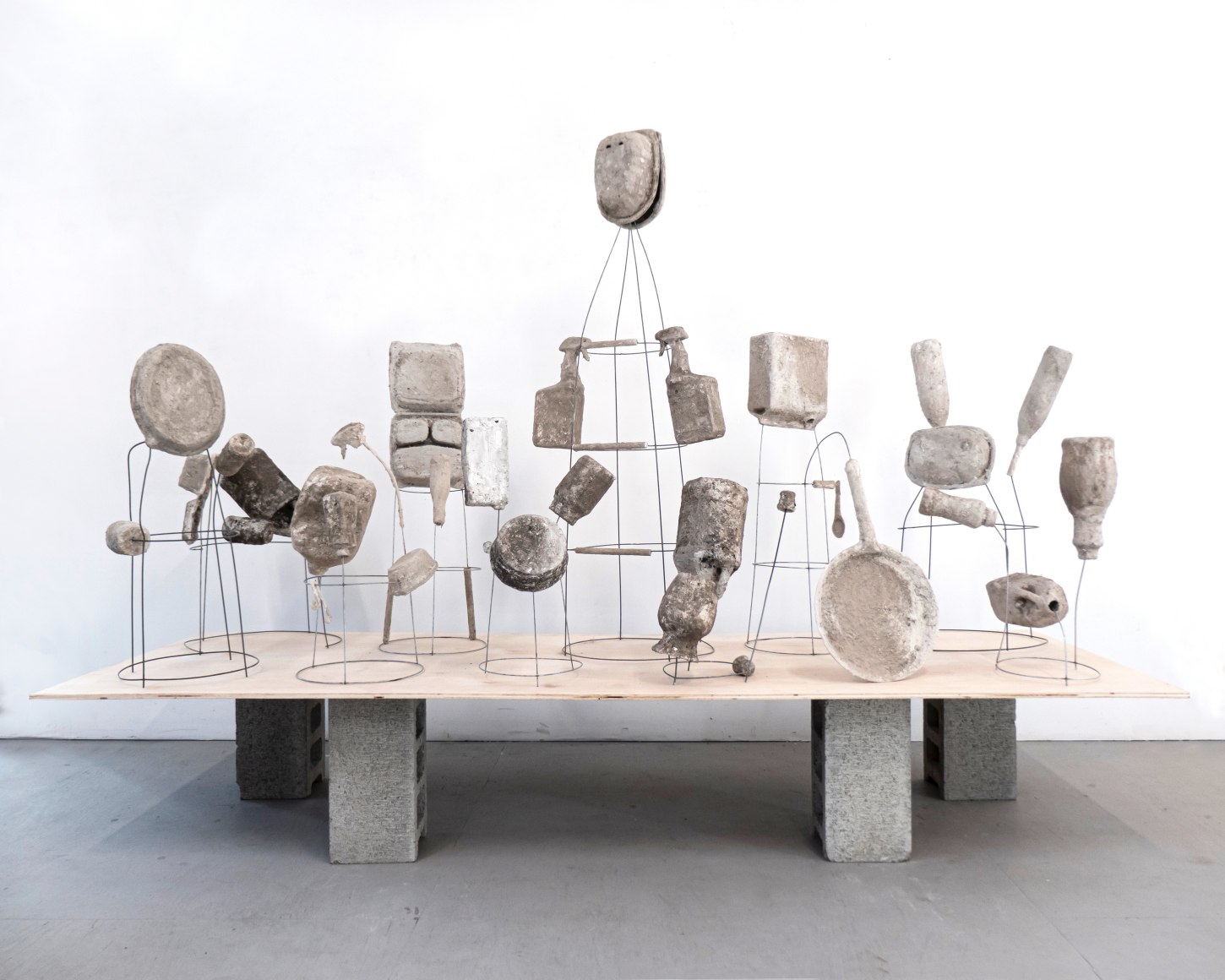 Erin Woodbrey  The Carrier Bag Series, 2020-2021  Single-use plastic, metal, and paper containers, foam, ash, plaster, and gauze  Variable Dimensions